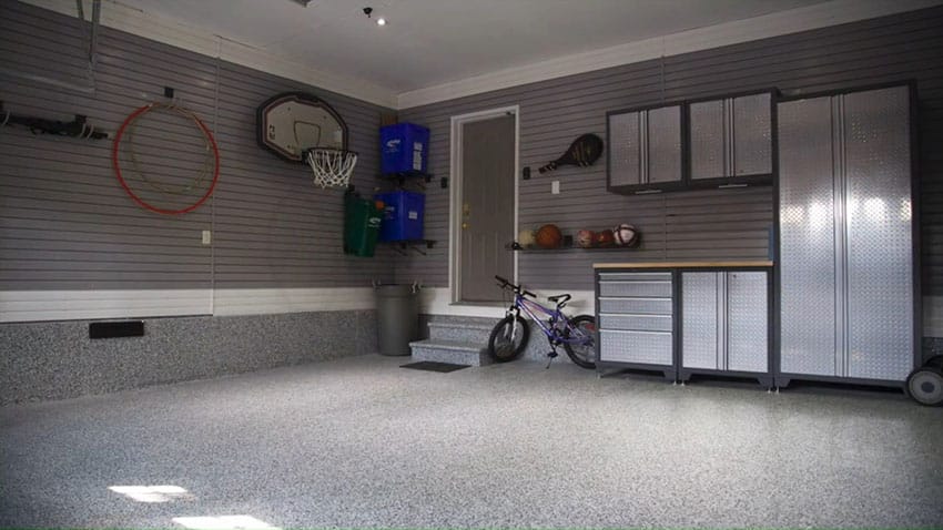 Garage renovation with storage cabinets and finished flooring