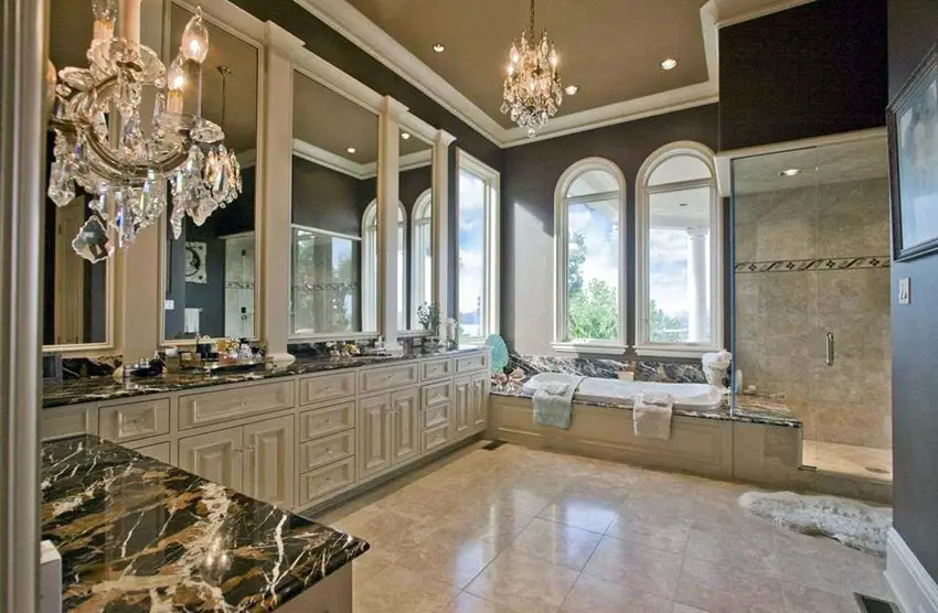 Large master bathroom with large vanity, enclosed tub and chandelier lighting