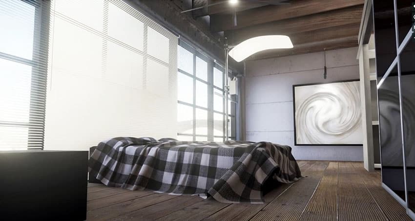 Loft bedroom with wide plank wood floors wall of windows