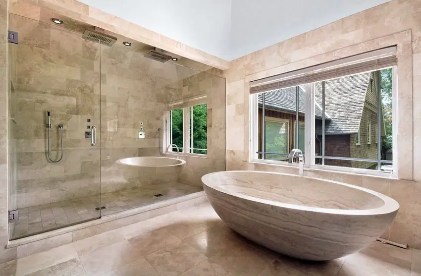 Bathroom with expansive shower section and custom stone tub