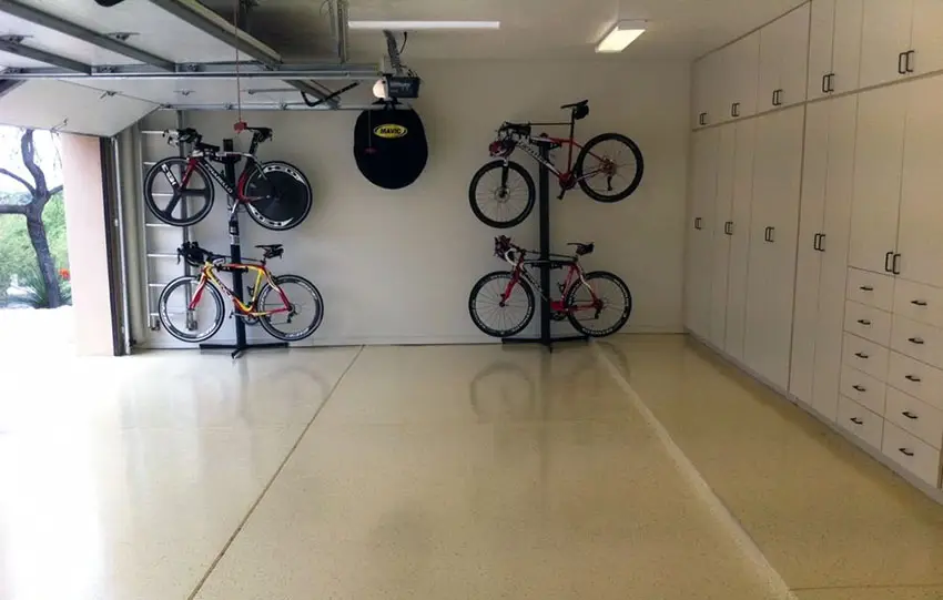 Organized garage with cabinets, bike racks and polyurethane floor
