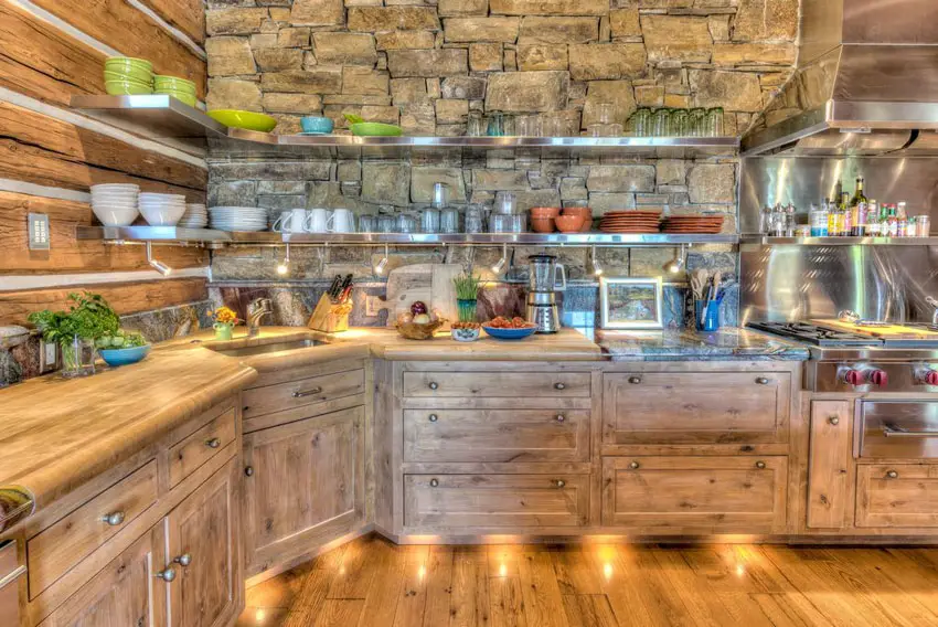 Rustic kitchen with solid wood cabinets wood counter and stone back splash