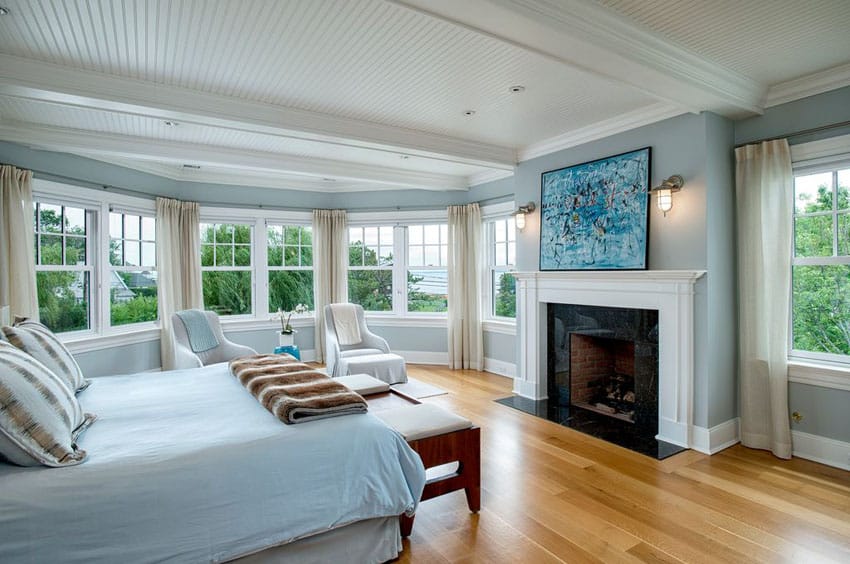 Traditional bedroom with light wood plank floors