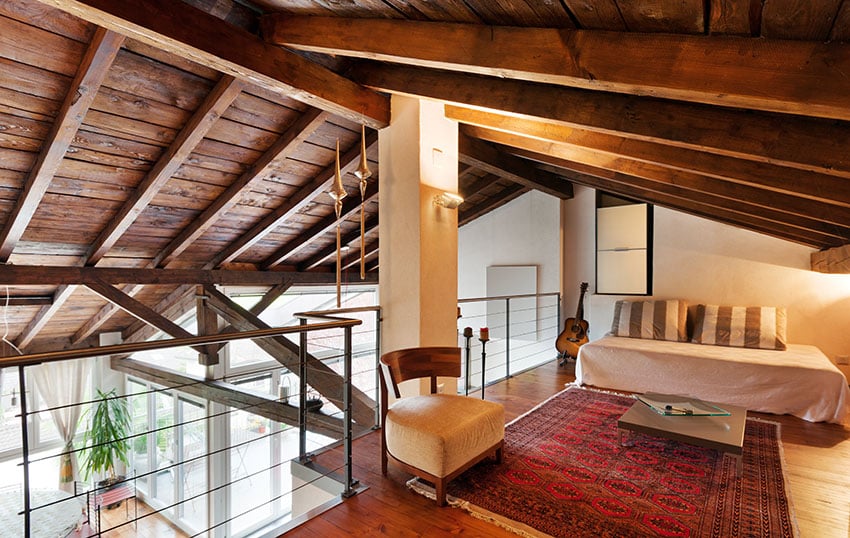 Upstairs bedroom loft with wood beam vaulted ceiling