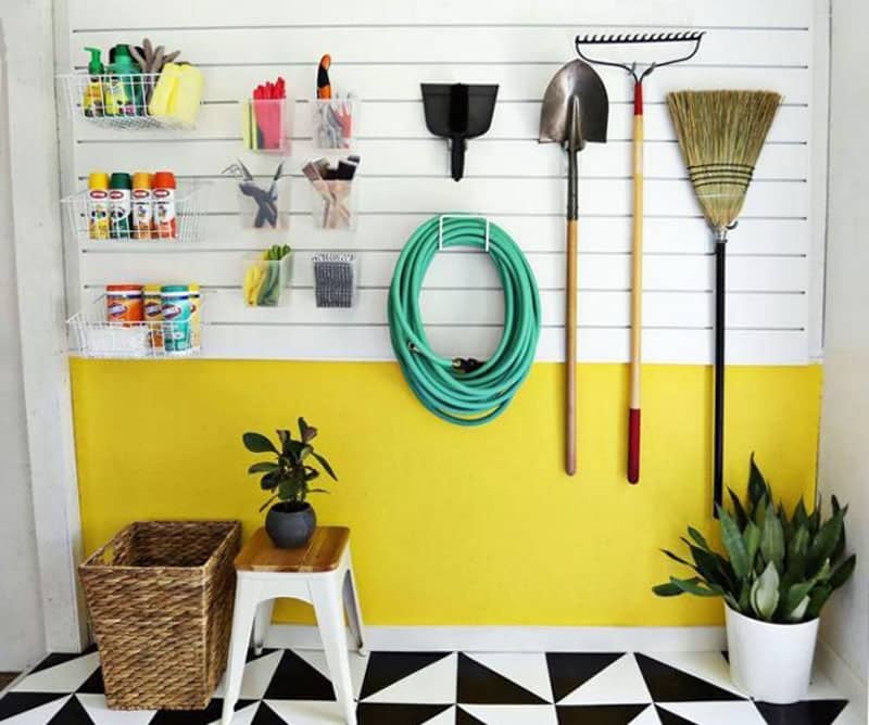 Well organized garage and rack storage for garden tools
