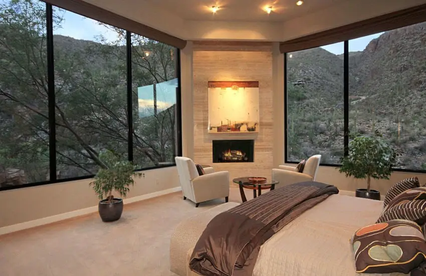 Amazing views from bedroom with large windows and corner fireplace