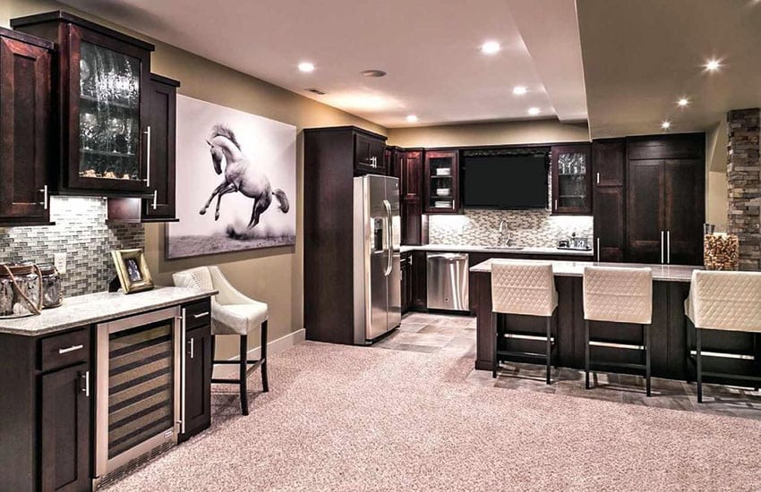 Bar and kitchen with wine fridge and glass backsplash