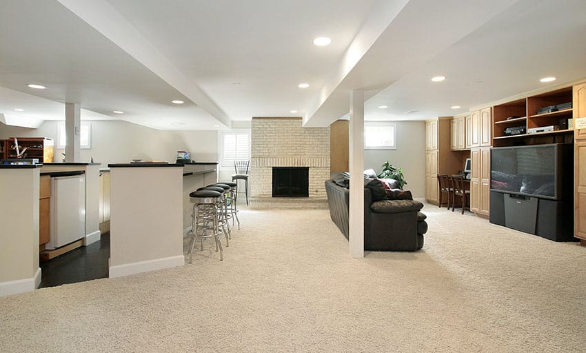 Basement living room with home bar fireplace and tv area