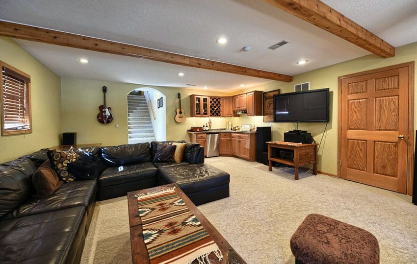 Basement living room with sectional leather sofa and corner home bar