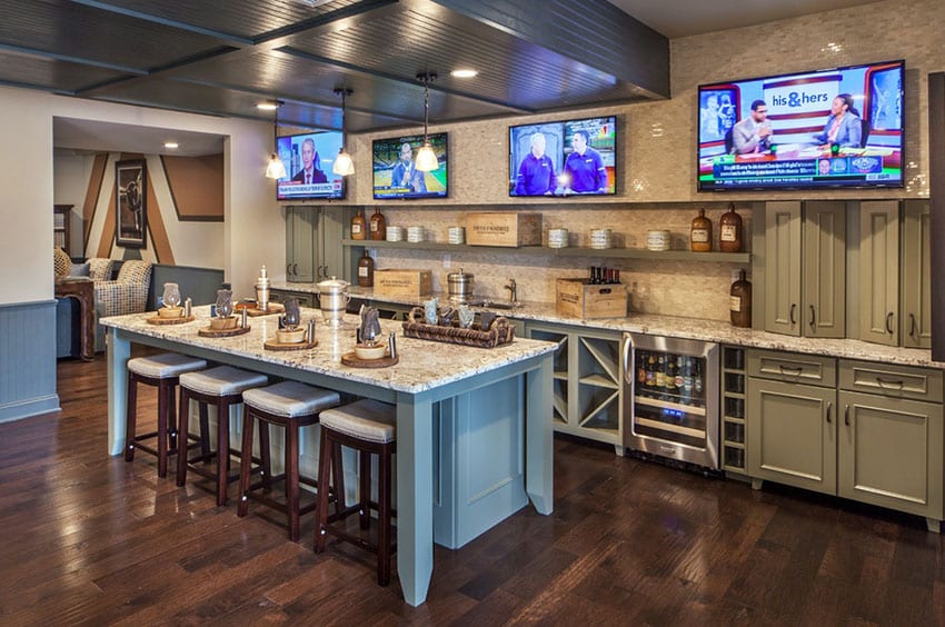 Basement wet bar with bar stools and multiple tvs