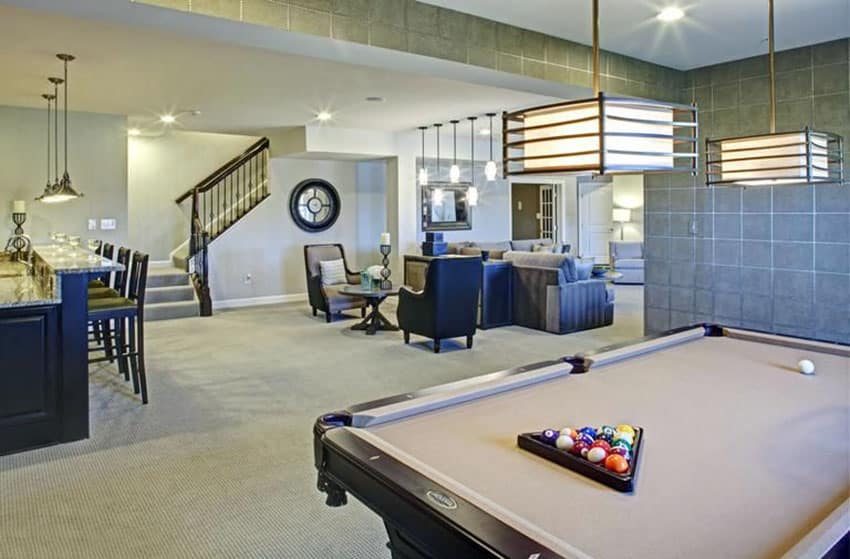 Basement with pool table, granite home bar and sitting area