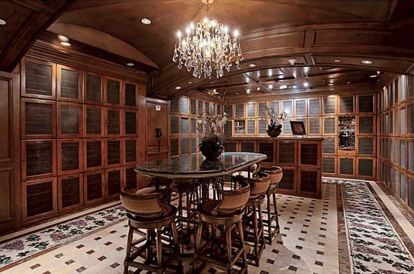 Beautiful luxury wine cellar basement with dining table and chandelier