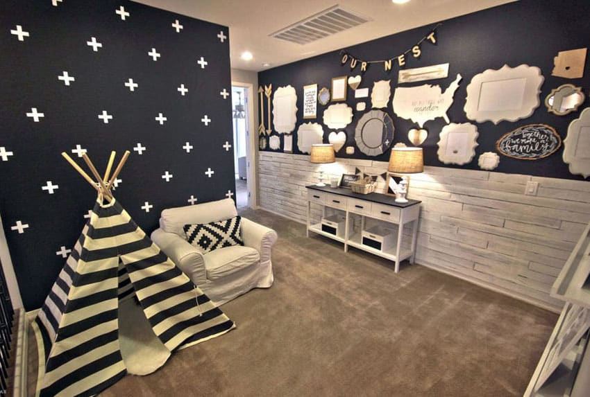 black and white basement playroom with kids tent