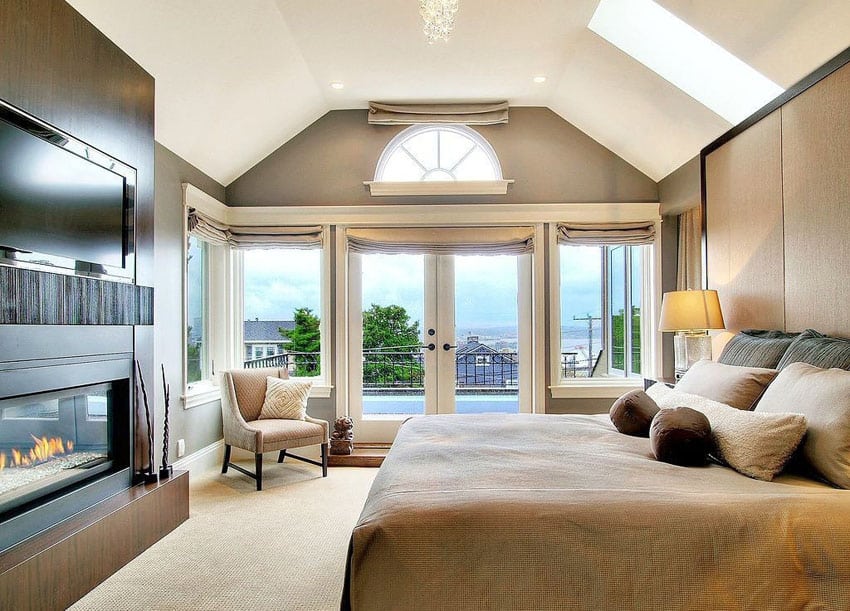 Contemporary suite bedroom with expansive views and fireplace