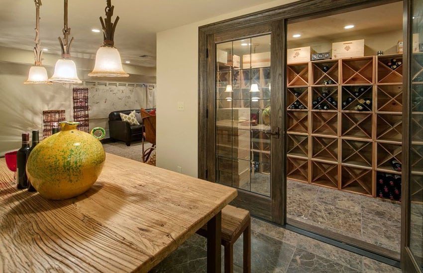 Craftsman basement with walk in wine storage and sliding glass doors