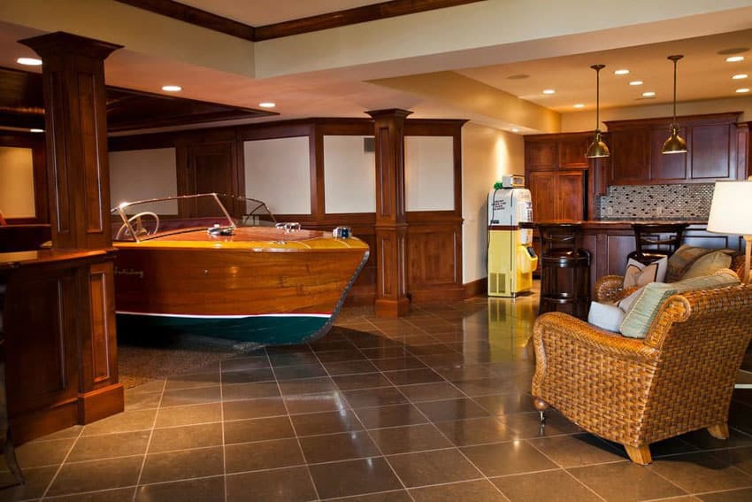 Eclectic basement with antique wood boat and home bar