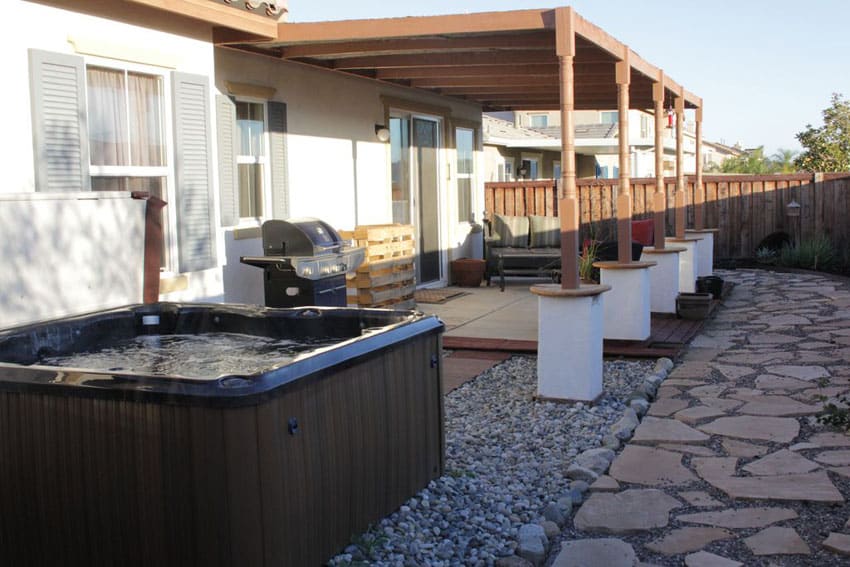 Flagstone and gravel backyard patio
