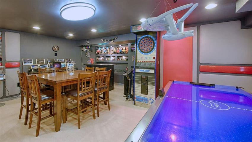Game room basement with air hockey and star trek memorabilia and decor