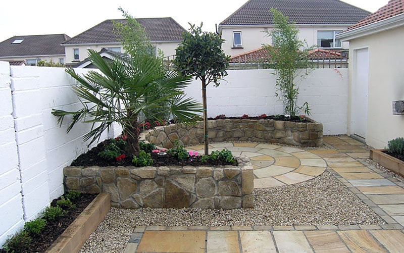 Gravel and stone landscaped backyard