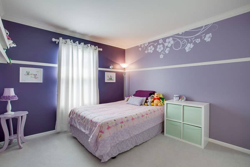Light purple and dark purple color girls bedroom with flower wall stencil