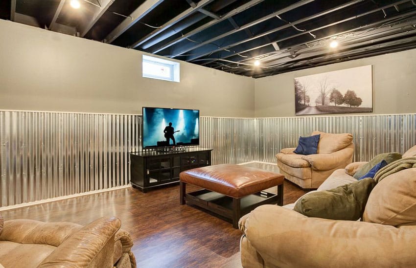 Lounge basement with rustic corrugated steel wall paneling and exposed ceiling