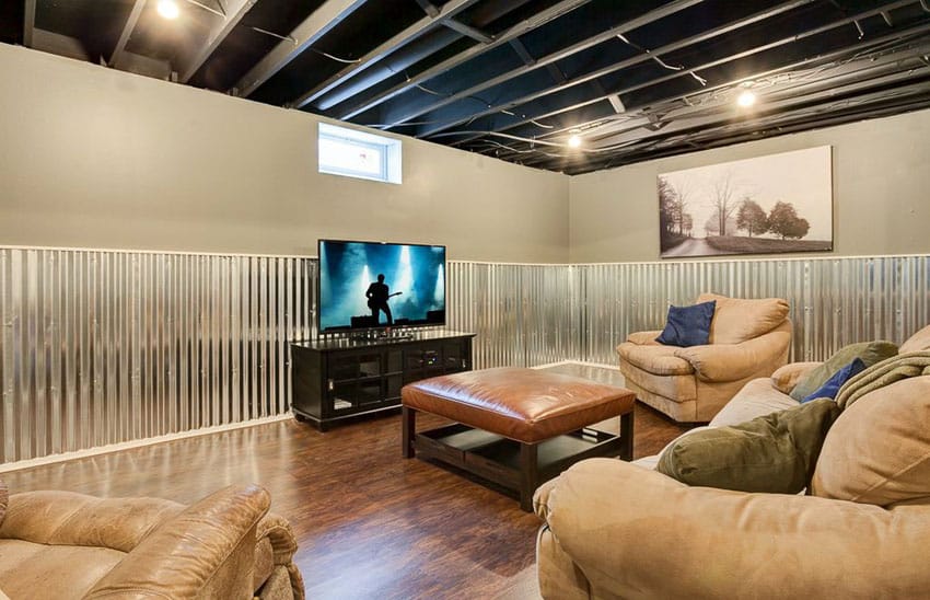 lounge basement with rustic corrugated steel wall paneling and exposed ceiling