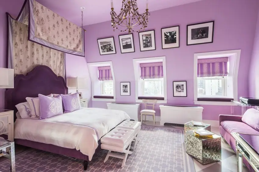 Lovely purple bedroom with purple bed frame white furniture and chandelier