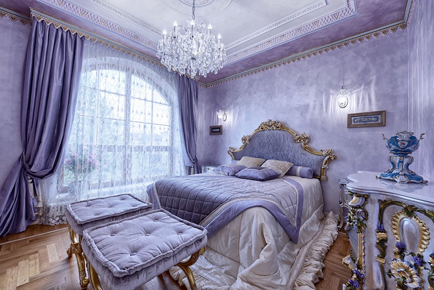 purple bedroom with white furniture