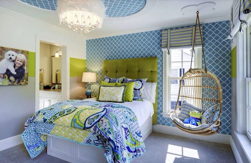Luxury kids bedroom with rattan swinging chair bed with tufted headboard and glam feather chandelier