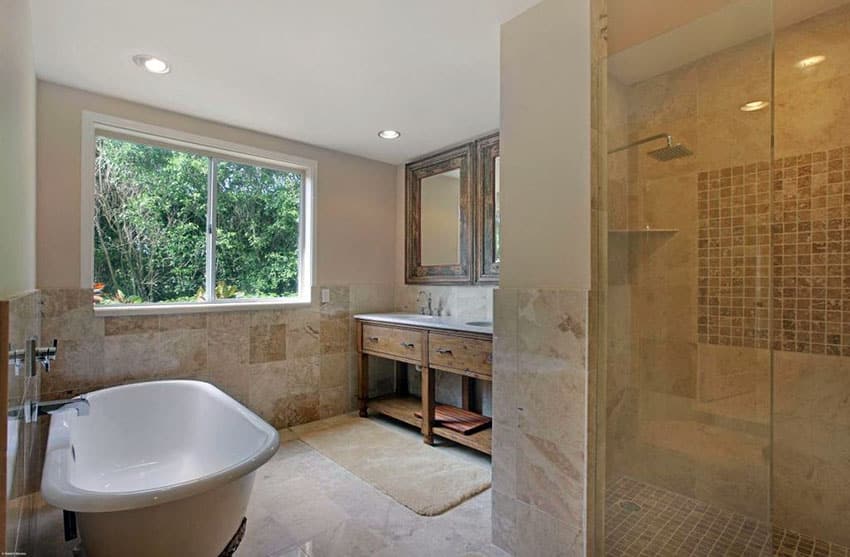 master bathroom with mosaic square insert and travertine in the shower