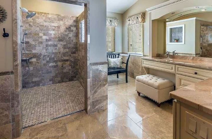 Luxury shower with travertine tile in cream color vanity bathroom