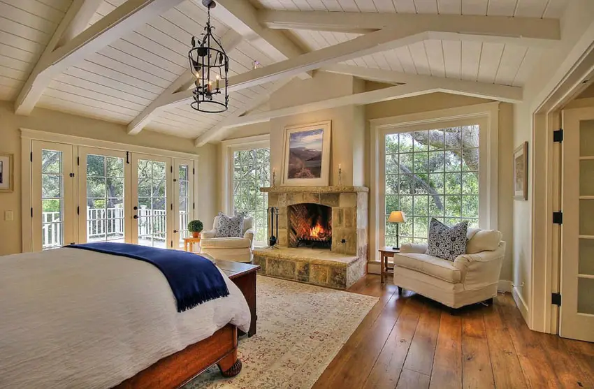 Master bedroom with center fireplace and large picture windows