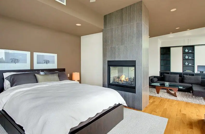 Modern bedroom with tile gas fireplace 
