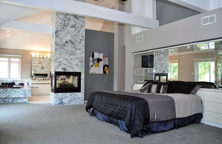 Modern master bedroom with marble fireplace