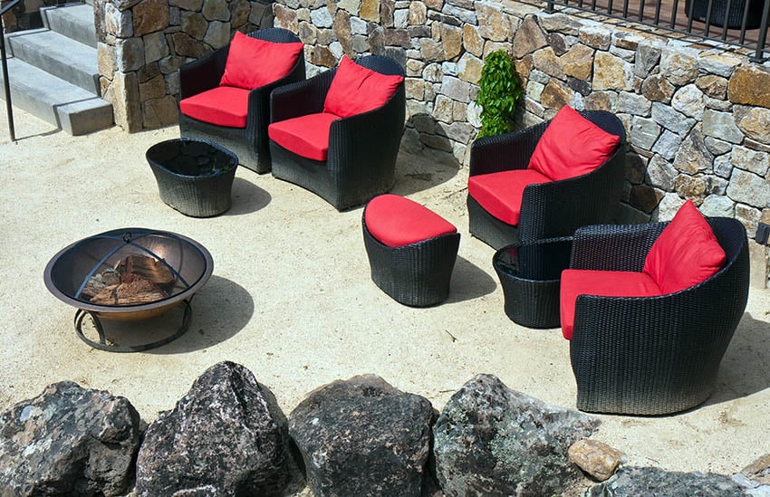 Packed gravel with outdoor rattan seating
