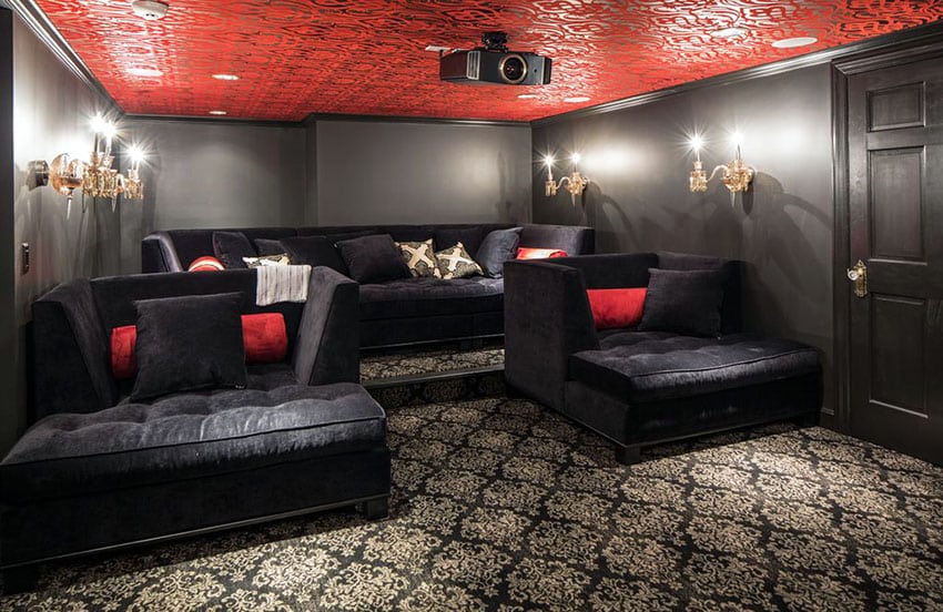 Plush basement home theater with patterned carpet and ceiling and lounge seats
