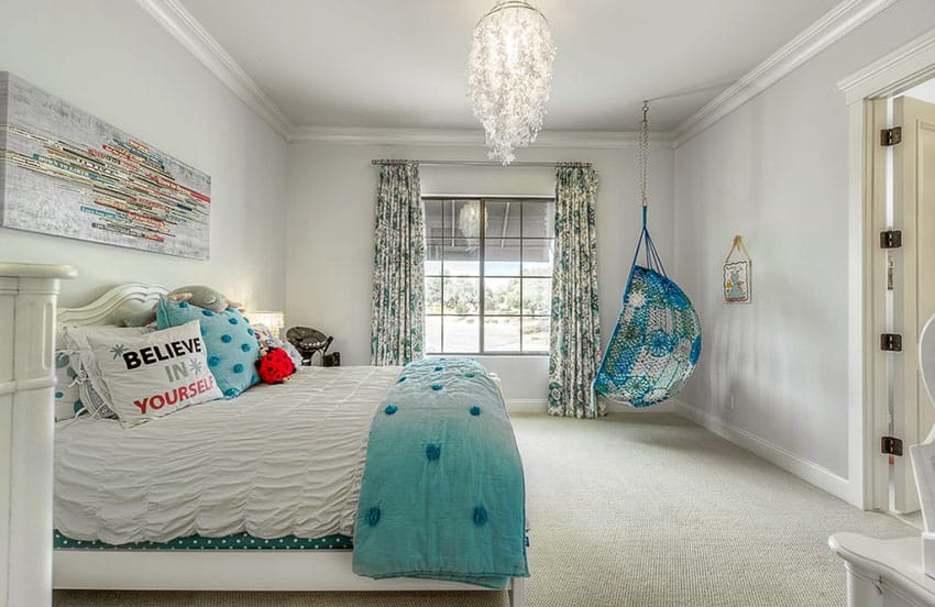 Bedroom with aqua color hanging chair and feather chandelier