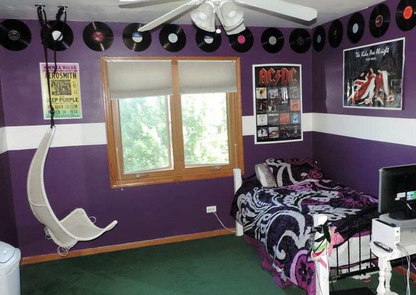 Purple kids bedroom with white semi circle swinging chair