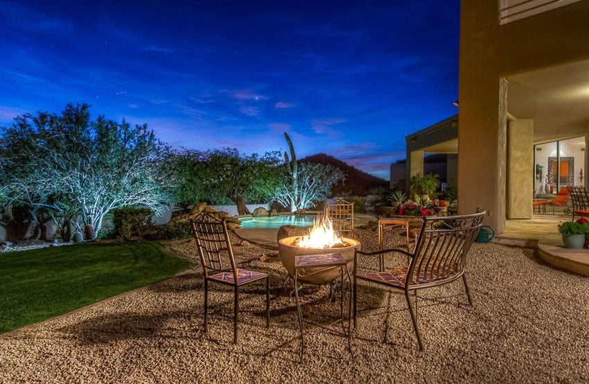 Loose gravel patio with outdoor dining table