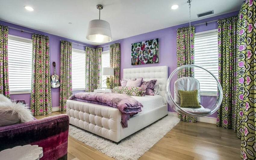 Teens bedroom with purple walls, shag carpet and see through swinging bubble chair with cushions