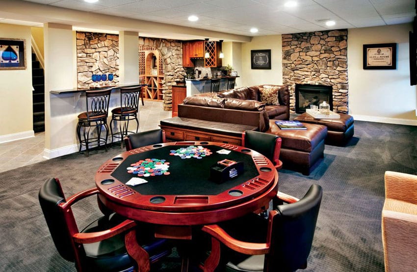 Traditional basement with poker table leather sofa and small bar counter with bar stools