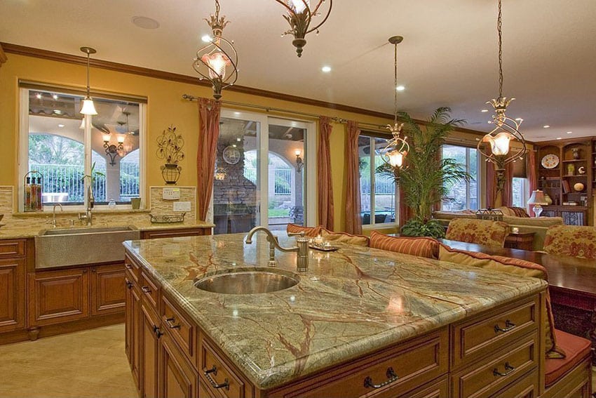 Traditional kitchen with custom island with attached bench with upholstery