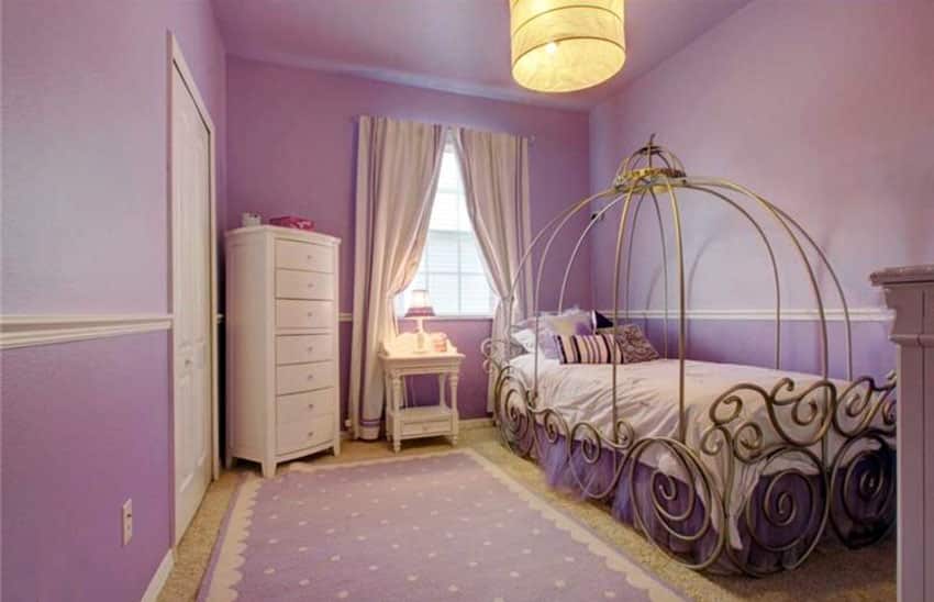 Two tine purple girls bedroom with canopy bed and white furniture