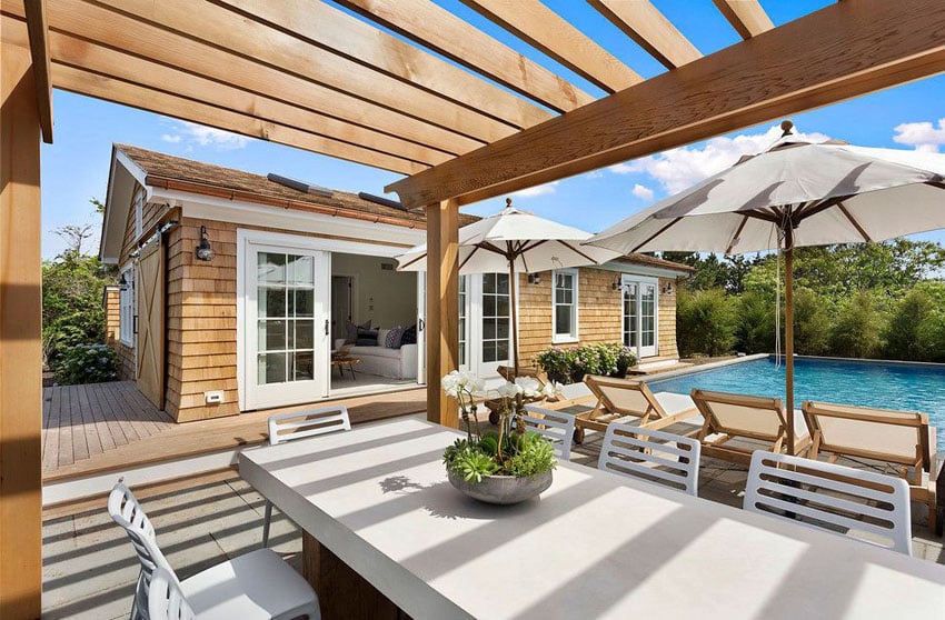 Backyard pergola and outdoor dining table and pool