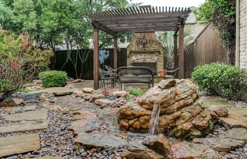 Cherry pergola next to water feature fountain