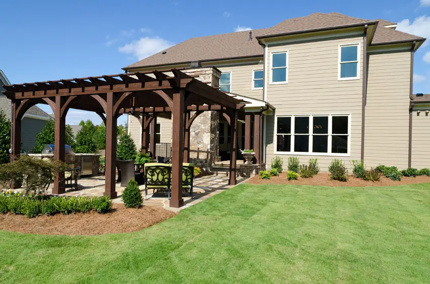 Pergola with dark mocha finish with outdoor grilling area