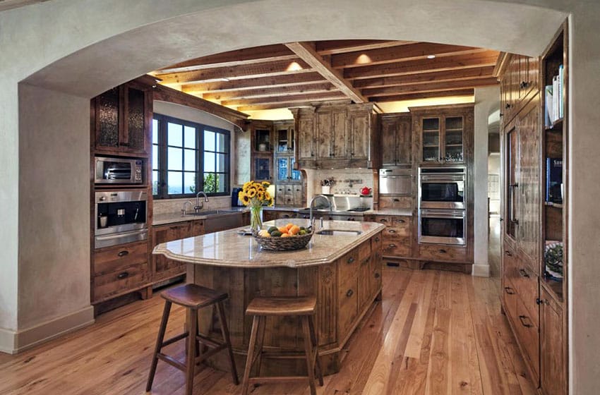 Beautiful country style kitchen with solid wood cabinets and rounded island with granite countertops
