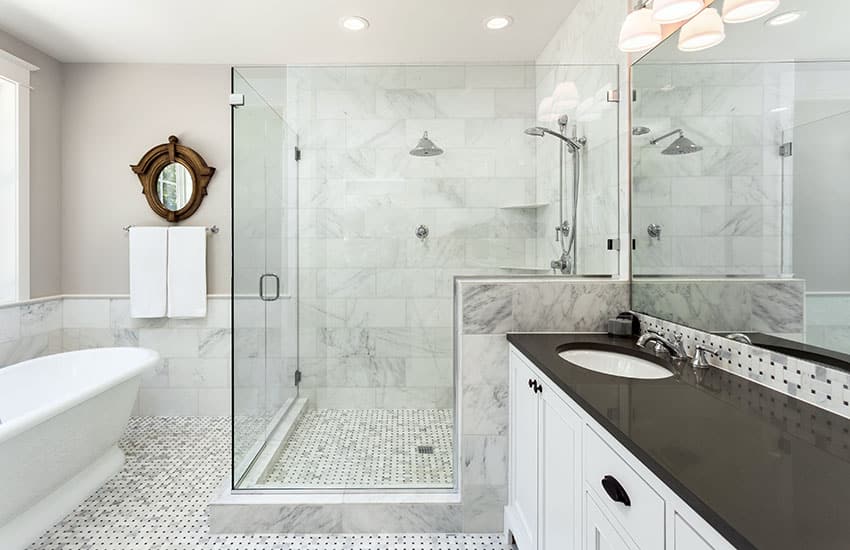 Black and white bathroom design with white vanity black countertop