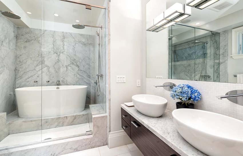 Bathroom with his and hers basins, frameless mirrors and bar lights