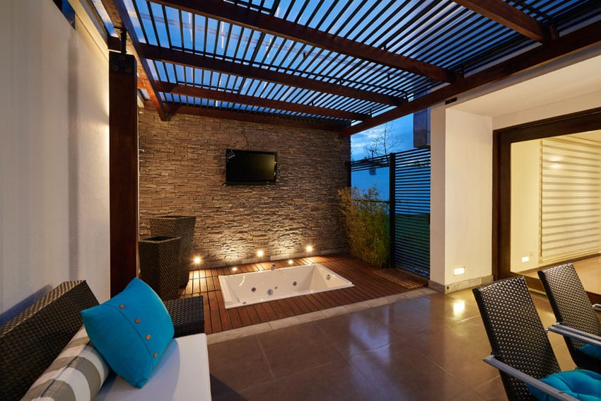 Contemporary covered patio with slatted wood pergola